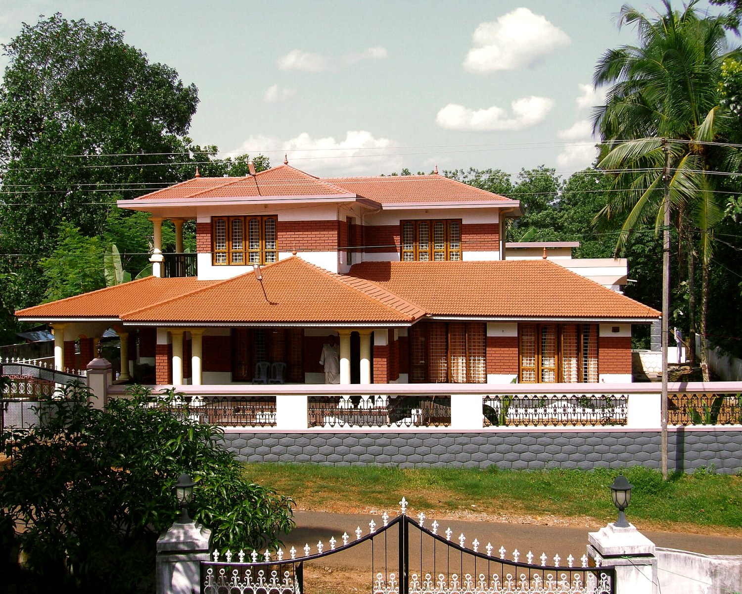 Modern two-storey RC house with terracotta tiled roofs